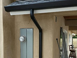 black fascia with black round downspout 1